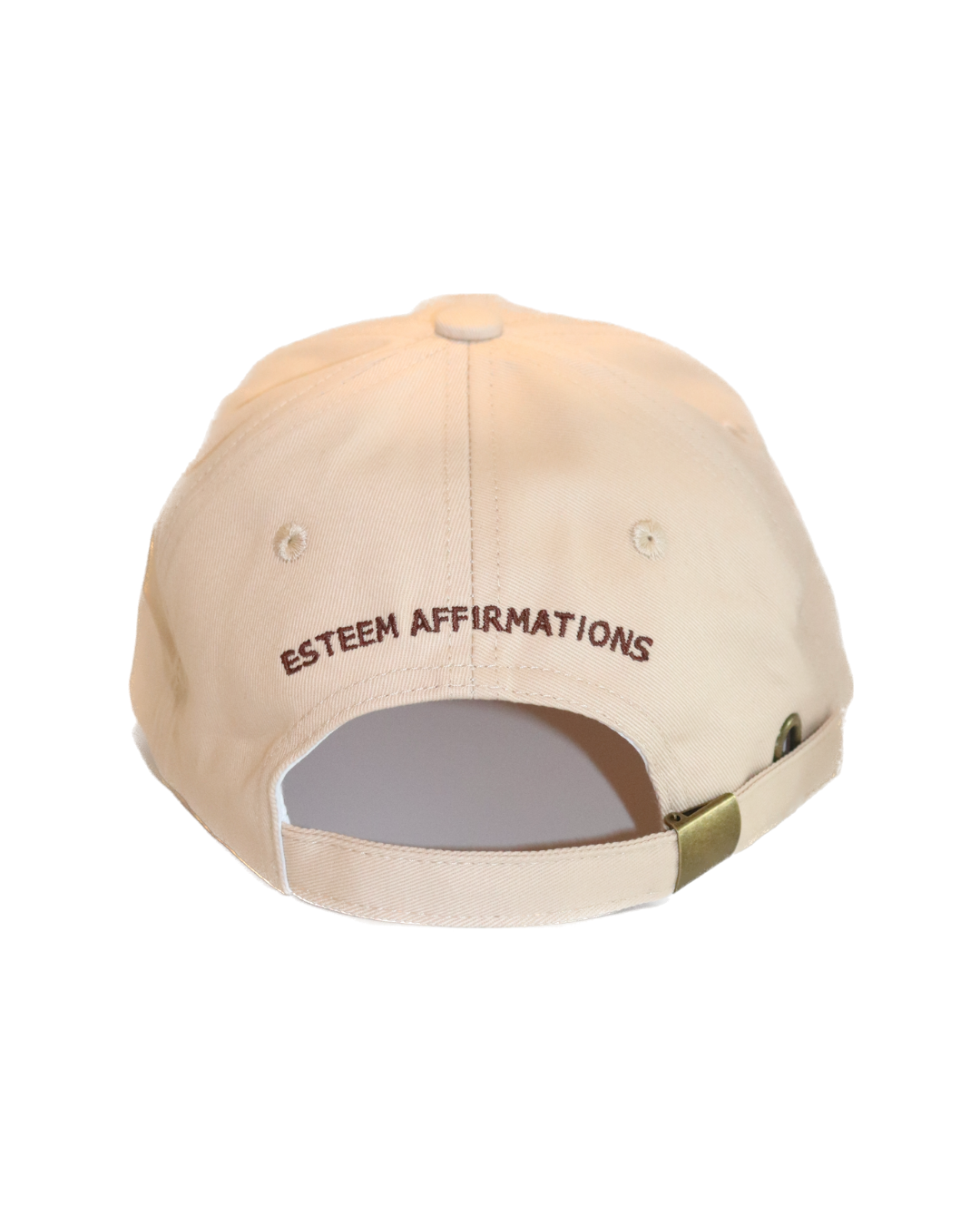 Back view of tan dad hat showing adjustable strap and 'Esteem Affirmations' embroidered above gold buckle