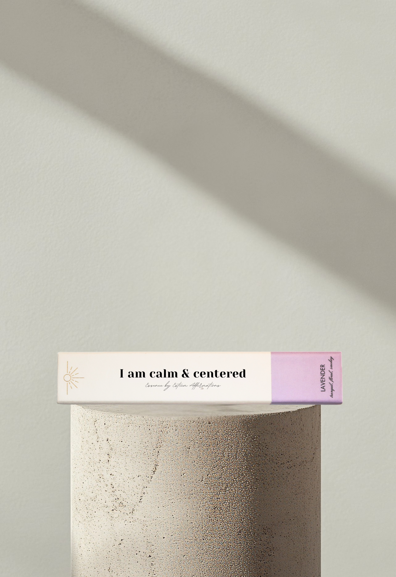 Wellness incense product showcased on a modern display podium with soft shadows and the affirmation I am calm & centered on the front box cover by Esteem Affirmations