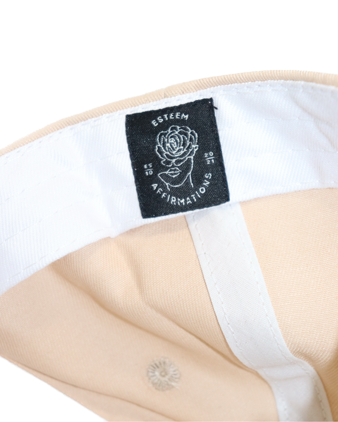 Inside view of dad hat featuring black EA logo tag stitched above sweatband