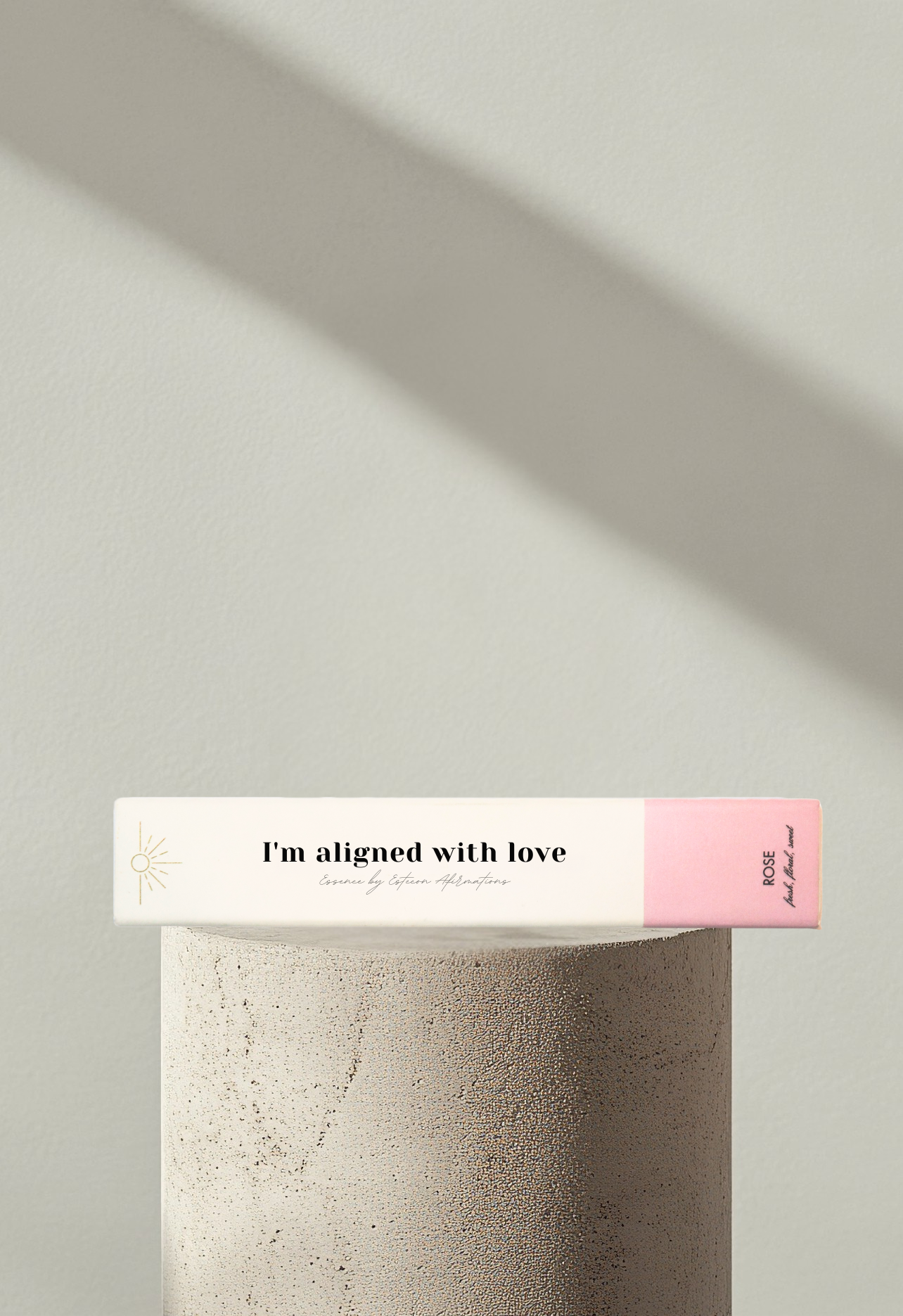 Wellness incense product showcased on a modern display podium with soft shadows and the affirmation I'm aligned with love on the front box cover by Esteem Affirmations