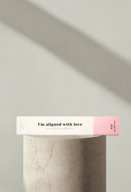 Wellness incense product showcased on a modern display podium with soft shadows and the affirmation I'm aligned with love on the front box cover by Esteem Affirmations