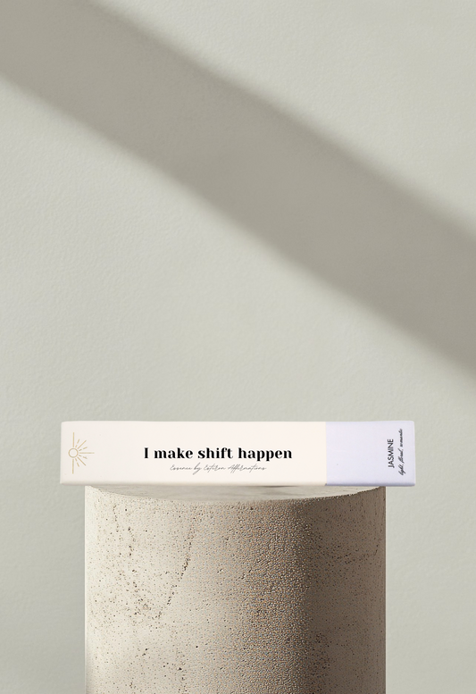 Wellness incense product showcased on a modern display podium with soft shadows and the affirmation I make shift happen on the front box cover by Esteem Affirmations